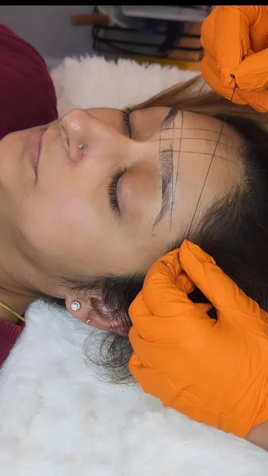 Precision brow mapping — string grid, client reclined, eyes closed