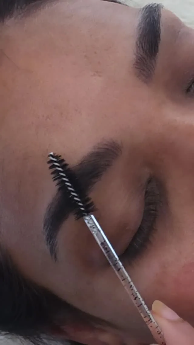 Precise brow shaping and grooming detail